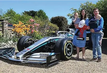  ?? DAILY MAIL PIC ?? Harry Shaw (in the arms of his father) has been provided a huge boost by the gesture of Lewis Hamilton.