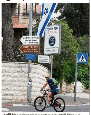  ??  ?? It’s official: A road sign indicating the way to the new US Embassy in Jerusalem. — AFP