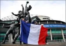  ?? AP PHOTO/IAN WALTON ?? French supporters pose for a photo as they arrive for the Autumn Nations Cup final rugby union internatio­nal match between England and France at Twickenham stadium in London, Sunday.