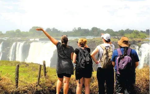  ?? ?? Tourists enjoy scenic views of the Victoria Falls