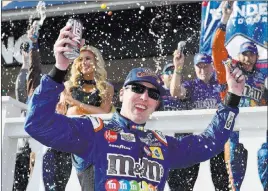  ?? Derik Hamilton ?? The Associated Press Kyle Busch celebrates after coming from the back of the pack to win the Gander Outdoors 400 on Sunday at Pocono Raceway in Long Pond, Pa.