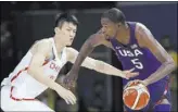  ?? CHARLIE NEIBERGALL/THE ASSOCIATED PRESS ?? Kevin Durant (5) of the U.S. drives past China’s Zou Peng during an Olympics pool-play basketball game in Rio de Janeiro on Saturday.