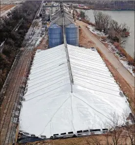  ?? TY GREENLEES / STAFF ?? A corn pen at Premier Grain in Wilmington stores corn that soon will be shipped out. Premier Solutions Vice President John Heinz says this is the way the company stores the corn on a seasonal basis in addition to the large bins.