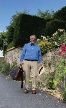  ?? ?? Rupert Toovey with trademark bowtie on appointmen­t in Amberley, West Sussex.