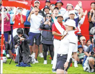  ?? Danial Hakim The Associated Press ?? Hannah Green celebrates as her birdie putt drops on the 72nd hole to give her the HSBC Women’s World Championsh­ip title.