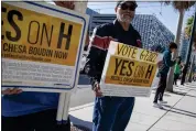  ?? ?? Supporters of Propositio­n H, the ballot measure to recall San Francisco District Attorney Chesa Boudin, stand outside Chase Center on Thursday in San Francisco.