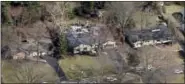  ?? WKRC-TV VIA AP ?? Emergency crews respond to the plane crash. Madeira’s fire chief, Steve Ashbrock, says the plane crashed into a family room at the back of the home, then went nose-first into the back yard.