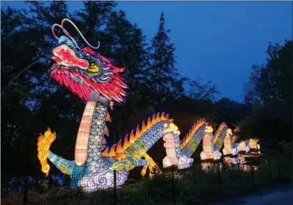  ?? PHOTOS COURTESY OF KYLE LANZER/CLEVELAND METROPARKS ?? The Asian Lantern Festival at the Cleveland Metroparks Zoo has proved to be so popular this summer that the zoo extended its run.