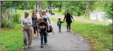  ?? DIGITAL FIRST MEDIA FILE PHOTO ?? People walk along the Schuylkill River Trail in Pottstown. Exercising outdoors in nature has health benefits and is a great way to celebrate Earth Day.