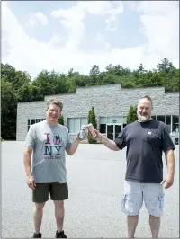  ?? MEDIANEWS GROUP ?? Artisanal Brew Works owners Colin Quinn and Kurt Borchardt toast to the company’s upcoming expansion in Wilton.