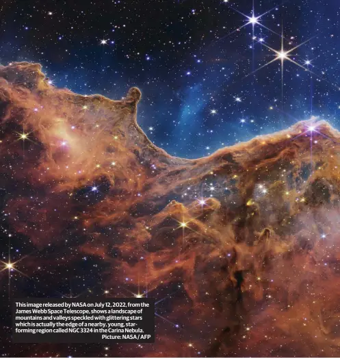 ?? Picture: NASA / AFP ?? This image released by NASA on July 12, 2022, from the James Webb Space Telescope, shows a landscape of mountains and valleys speckled with glittering stars which is actually the edge of a nearby, young, starformin­g region called NGC 3324 in the Carina Nebula.