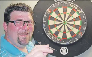  ?? DAVE STEWART/THE GUARDIAN ?? Fresh off his first-ever national championsh­ip win, Darren MacNevin of Charlottet­own has his eye on the bull’seye at a nationally ranked tournament coming to Summerside in September.