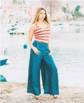  ?? DREAMSTIME ?? Puddle pants are women’s wide-leg, intentiona­lly oversized pants that “puddle” at the ankle.