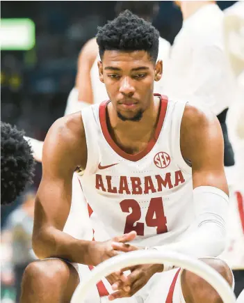  ?? CARLY MACKLER/GETTY ?? Alabama’s Brandon Miller sits during a timeout against Texas A&M in the SEC Tournament title game on Sunday at Bridgeston­e Arena in Nashville, Tennessee.