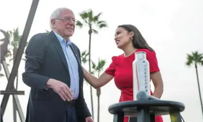  ??  ?? Alexandria Ocasio-Cortez introduces Bernie Sanders at a campaign rally at Venice Beach in Los Angeles, California, last week. Photograph: Monica Almeida/Reuters