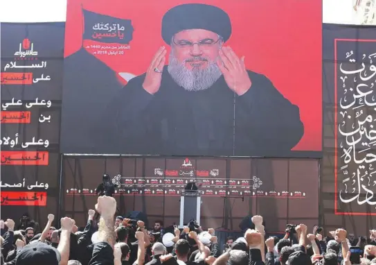  ?? (Reuters) ?? HEZBOLLAH LEADER Hassan Nasrallah preaching extremism to a crowd of zealous followers earlier this year.