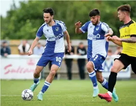  ??  ?? Aaron Collins on the ball for Bristol Rovers against Melksham last Friday