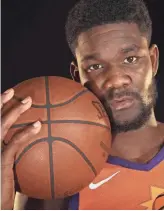  ??  ?? Suns center Deandre Ayton enters his second season after averaging 16.3 points and 10.3 rebounds last season. ROB SCHUMACHER/THE REPUBLIC