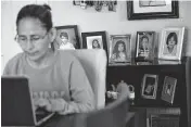  ?? GENARO MOLINA TNS ?? Claudia Aleman works on her computer at home on April 18 in South Gate, California. The Aleman family will be impacted if the federal internet subsidy Affordable Connectivi­ty Program expires at the end of April.