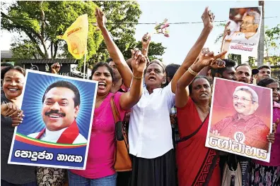  ?? AFP ?? Let us rejoice peacefully, with dignity and discipline in the same manner in which we campaigned. Gotabaya Rajapaksa
Supporters of Gotabaya Rajapaksa shout slogans as he leaves the Election Commission office in Colombo.