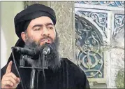  ?? PHOTO] [AP ?? This file image made from video posted on a militant website July 5, 2014, purports to show the leader of the Islamic State group, Abu Bakr al-Baghdadi, delivering a sermon at a mosque in Iraq during his first public appearance.