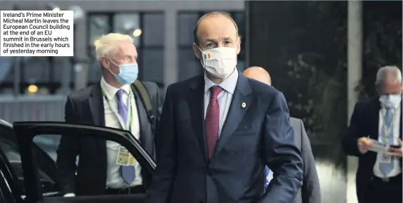  ??  ?? Ireland’s Prime Minister Micheal Martin leaves the European Council building at the end of an EU summit in Brussels which finished in the early hours of yesterday morning