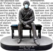  ??  ?? LEGEND: Taylor’s statue dons a mask