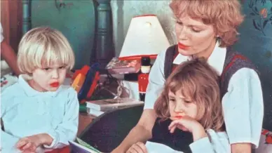  ??  ?? Mia Farrow, with her children Ronan Farrow, left, and Dylan Farrow.
