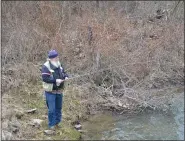  ?? ROGER MALLON — MEDIANEWS GROUP ?? A fisherman enjoys a spot along the Pine Creek. The state awarded a grant to help control pollution in the area.