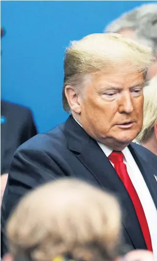  ??  ?? Donald Trump comes face to face with Canada’s Justin Trudeau, right, in Watford yesterday. A video of Mr Trudeau’s conversati­on with world leaders at Buckingham Palace, below, earlier went viral online