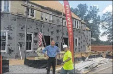  ?? MATT KEMPNER / AJC ?? Work has begun on homes in Fayette County that are designed to have a mix of European and southern flair. Pinewood Forrest President Rob Parker says lots of green space will be included.