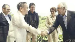  ?? ?? Internatio­nal Volleyball Federation president Ary da Silva Graca congratula­tes Philippine Olympic Committee president Rep. Abraham Tolentino and Philippine National Volleyball Federation president Ramon Suzara (third from left). Also in photo are FIVB general director Fabio Azevedo (left) and Graca’s wife Marina.