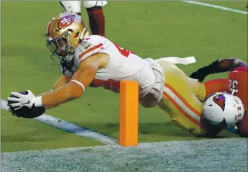  ?? RICK SCUTERI – THE ASSOCIATED PRESS ?? Fullback Kyle Juszczyk of the 49ers dives into the end zone for one of his two second-half touchdown receptions.