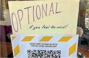  ??  ?? Mad Cafe in Collingwoo­d has added to its QR code sign, telling customers scanning in is ‘‘optional’’.