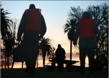  ?? PHOTO BY STAN LIM ?? Volunteers approach a homeless man in San Bernardino on Jan. 25, 2018, for the annual Point-In-Time Homeless Count throughout San Bernardino County. More volunteers are needed for the 2023 count.