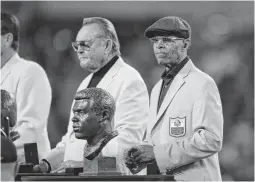  ?? STACY REVERE/GETTY IMAGES ?? Gale Sayers was honored with other Hall of Famers at halftime of a 2016 Bears game at Soldier Field in Chicago. He was inducted into the Hall in 1977 at age 34.