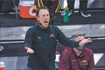  ?? COURTESY PHOTO ?? Minnesota head coach Richard Pitino questions a call during a Big Ten Conference Tournament game. Pitino was recently named the new Lobos’ head coach.