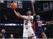  ?? ARTIE WALKER JR./THE ASSOCIATED PRESS ?? South Carolina guard MiLaysia Fulwiley scores over Mississipp­i center Rita Igbokwe during the first half of Sunday’s game in Columbia, S.C.