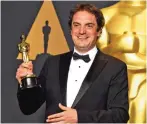  ??  ?? Sylvain Bellemare poses with the Oscar for Best Sound Editing for ‘Arrival’.