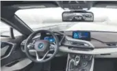  ??  ?? BMW’s i8 prototype plays live traffic footage on a monitor where the rearview mirror typically is.