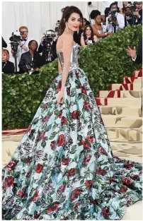  ??  ?? Quick change: Amal Clooney in the Quinn gown and, right, the red Ford dress