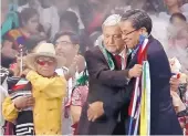  ?? COURTESY OF PRESIDENTI­AL OFFICE OF MEXICO ?? The new president of Mexico, Andrés Manuel López Obrador, embraces Navajo Nation President Russell Begaye during inaugurati­on ceremonies Dec. 1 in Mexico City.