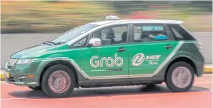  ?? EPA-EFE ?? Toyota Motor Corp aims to install its TransLog driving recorder devices into Grab’s fleet of lease cars to access the data on driving patterns that will be crucial to its push into the nascent mobilityas-a-service industry.