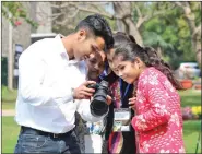  ?? IANS ?? During the workshop, girls were briefed about the technicali­ties of the camera and the need to visualise content better.