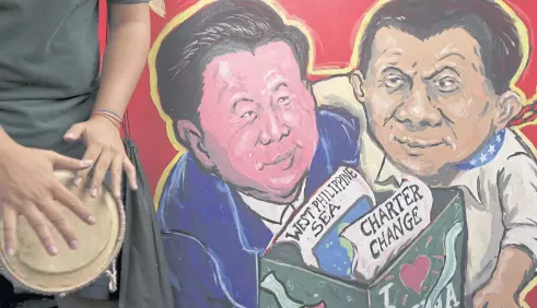  ?? EPA ?? ABOVE A caricature is displayed during a protest near the Chinese Embassy after the arrival of Chinese President Xi Jinping in Manila, who is on a two-day state visit.