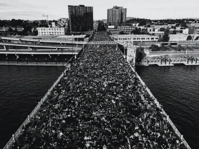  ??  ?? The country saw the largest civil-rights protests in generation­s. On Burnside Bridge in Portland, Oregon, some 15,000 people laid down, hands behind their backs, for nine minutes to protest
police brutality and the death of Floyd.
A NATION OF MILLIONS