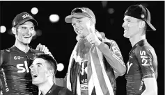  ?? — Reuters photo ?? Team Sky rider Chris Froome of Britain (second right) celebrates on the podium with team-mates after winning the Vuelta Tour of Spain.