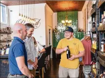  ?? MEETNKY/TNS VICTOR SIZEMORE FOR ?? Revival Bottle Shop in Covington, Kentucky, is a great place to taste and shop for bourbons produced before 1980.