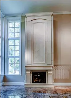  ??  ?? The current owners added a limestone fireplace to the lowerlevel great room at 1659 Chapel Ridge Lane in Adams.