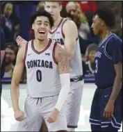  ?? Associated Press ?? STRONG AT THE TOP Gonzaga guard Julian Strawther celebrates his basket during the second quarter against San Diego in Spokane, Wash., on Saturday. Gonzaga is still undefeated and No. 1 in the AP Top 25 Poll.